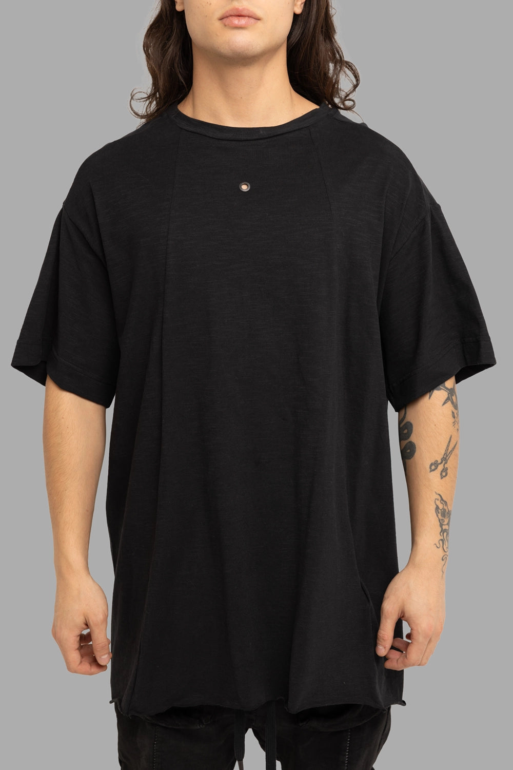 Justin Gall men’s T-shirt in black, front view, chest metal stud and vertical seam lines.