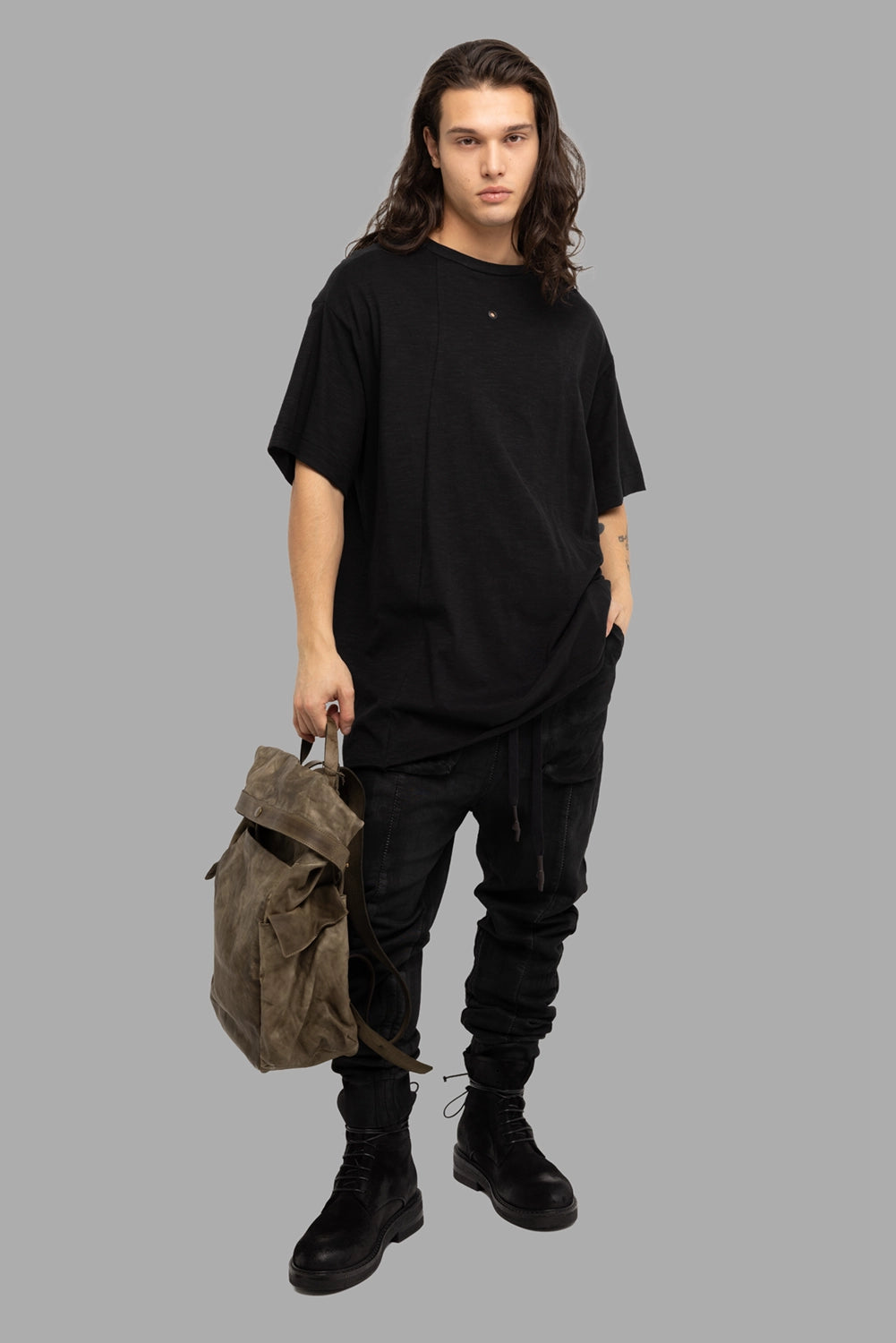 Justin Gall men’s T-shirt in black, on-model full length, oversized fit and longline hem.