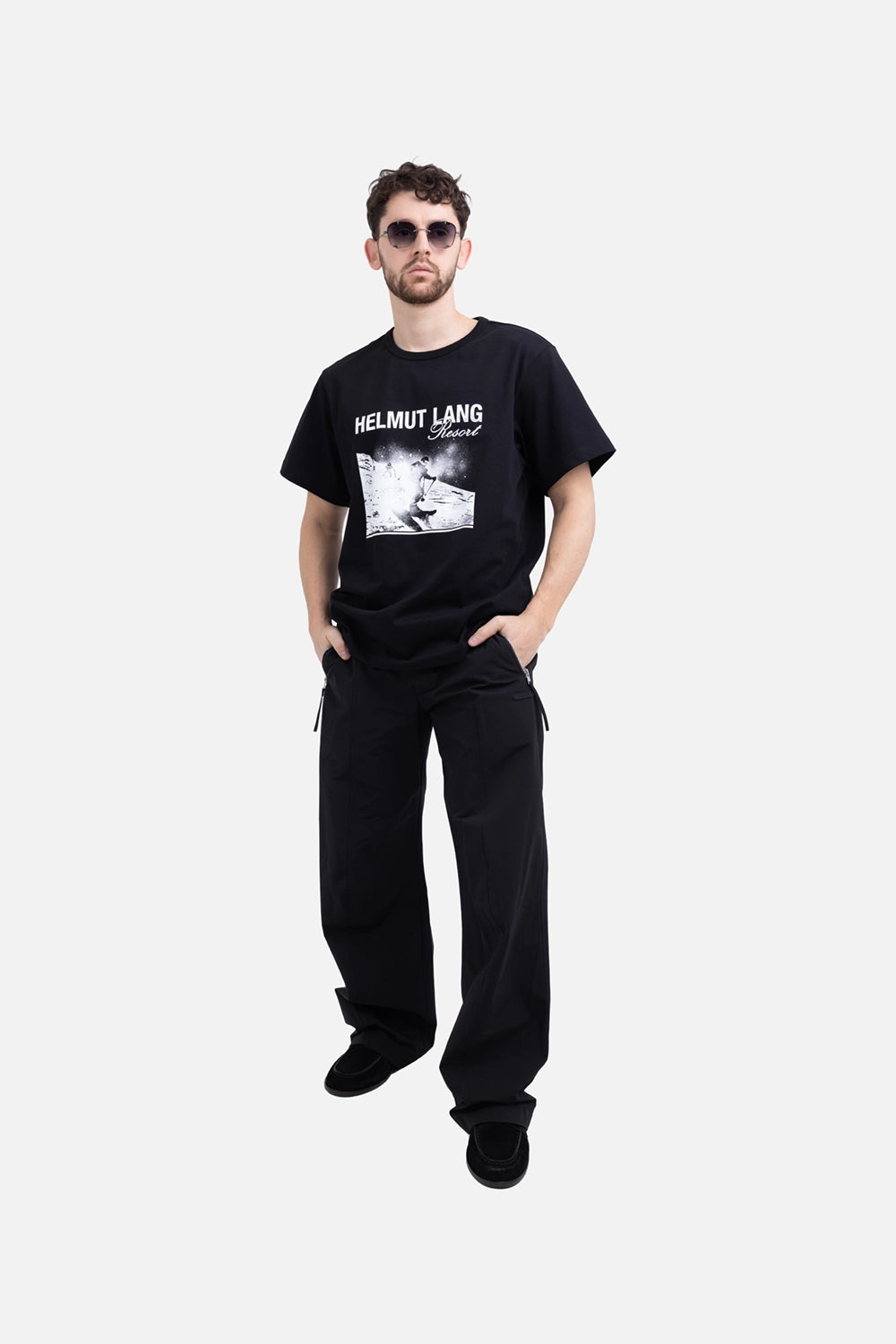 Helmut Lang men's T-shirt in black, on-model full-length view, relaxed fit with Resort skier graphic