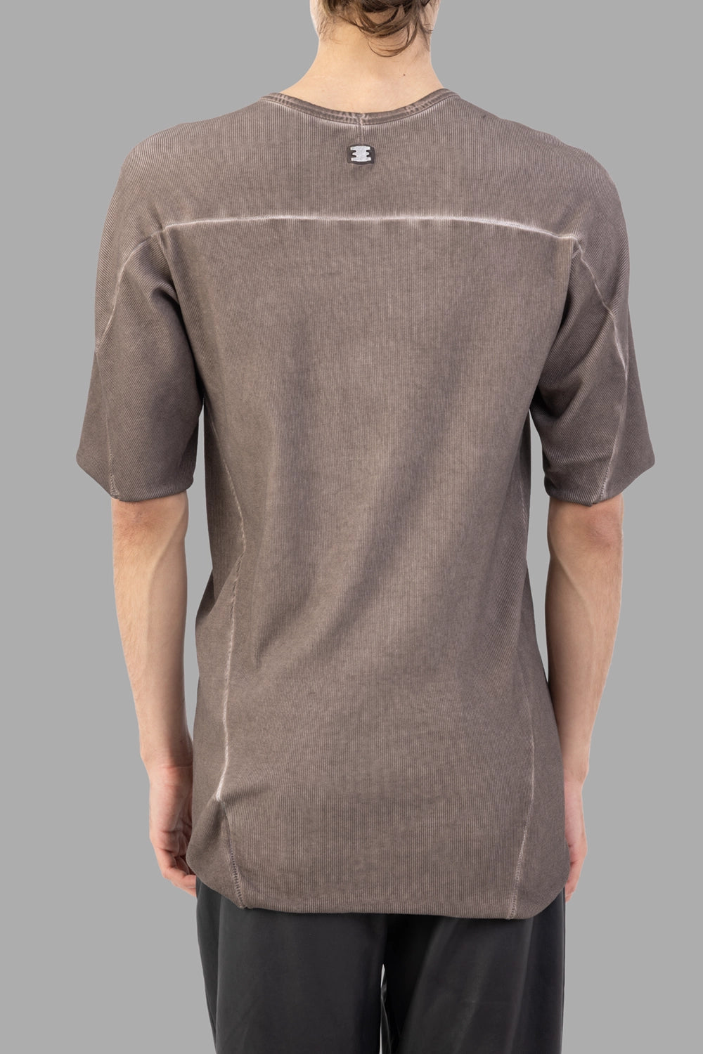 69 by Isaac Sellam T-shirt in taupe, back view, signature staple tab and horizontal yoke seam
