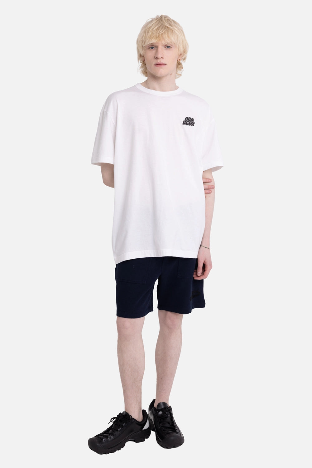 COMME des GARÇONS HOMME DEUX men's T-shirt in white, on-model full-length, small black chest logo