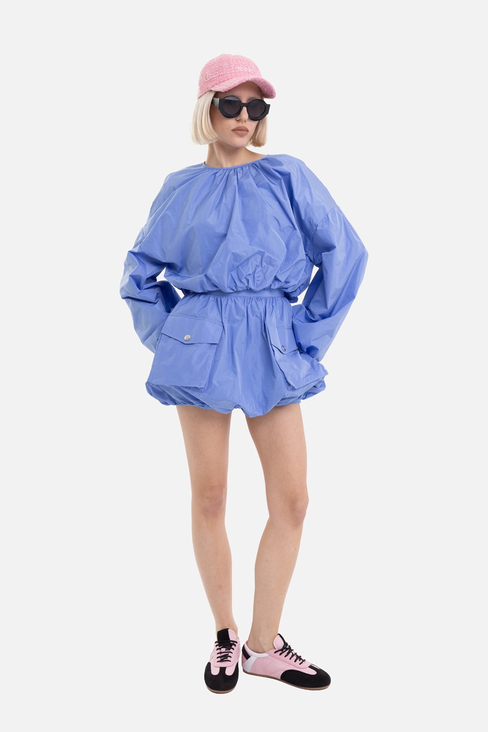 MSGM women's taffeta balloon miniskirt in light blue, on-model full-length with cargo flap pockets