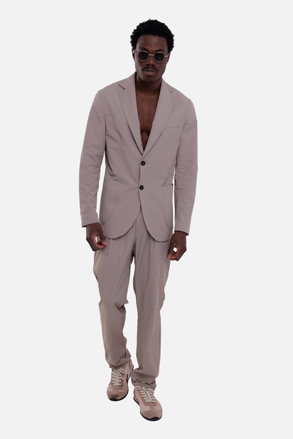 Gaëlle Paris men's blazer in fango, on-model full-length, two-button front and patch pockets