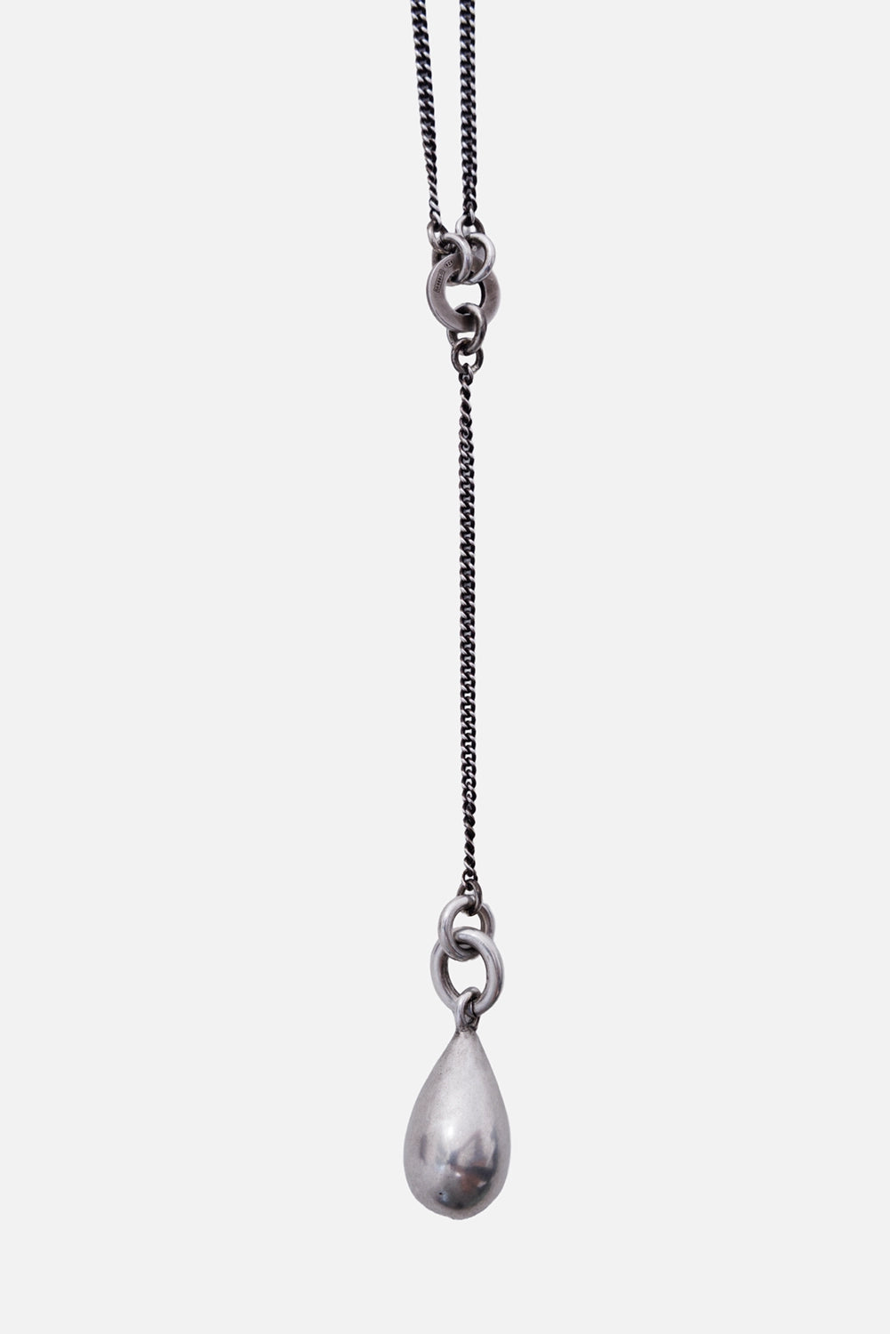 Ann Demeulemeester Tinne necklace in antique silver, close-up with linked rings and circular clasp