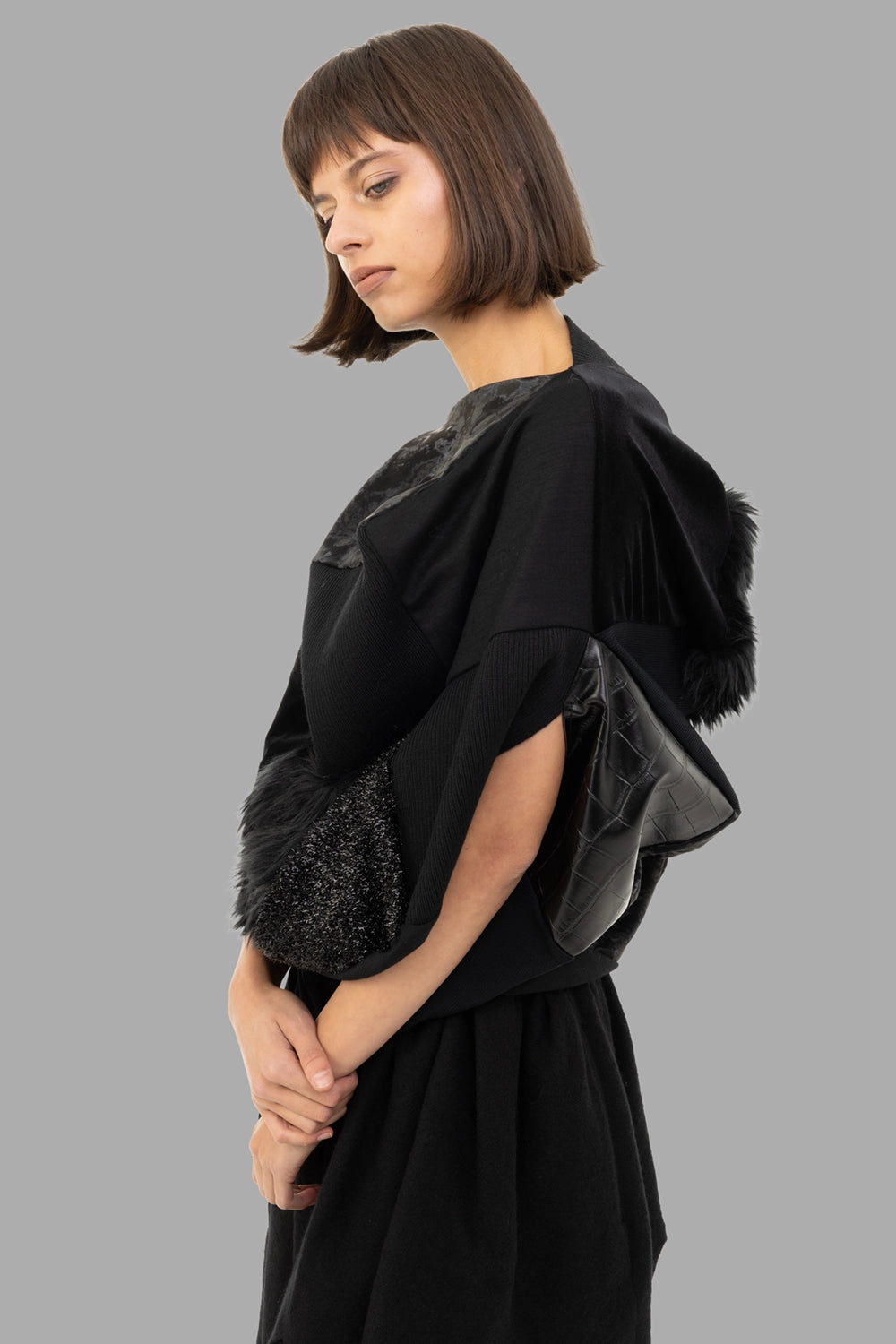 Junya Watanabe women patchwork top in black, 3/4 view, rib knit panel with mixed leather textures.