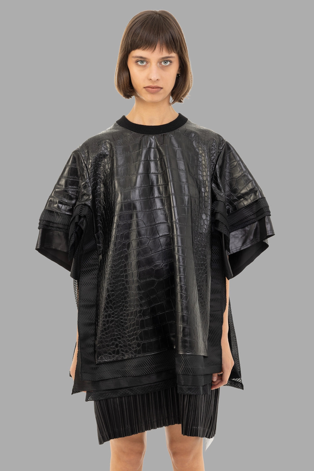 Junya Watanabe women’s faux-leather top in black, front view, croc-embossed panels and ribbed crew neck