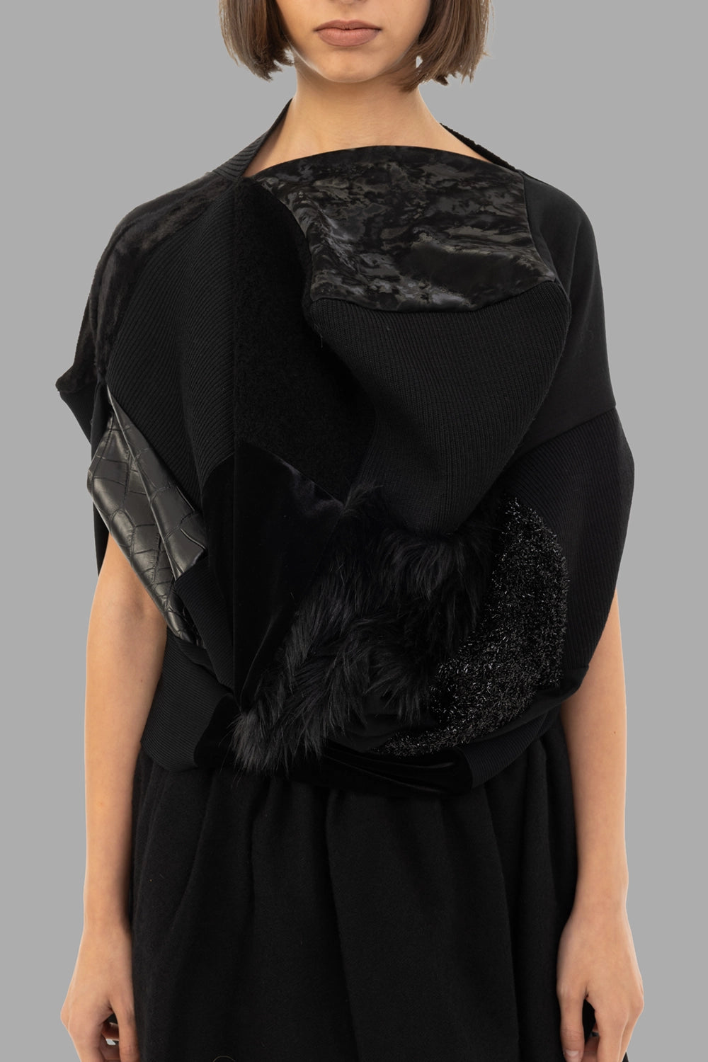 Junya Watanabe women patchwork top in black, front view, faux-fur, velvet and glossy leather panels.