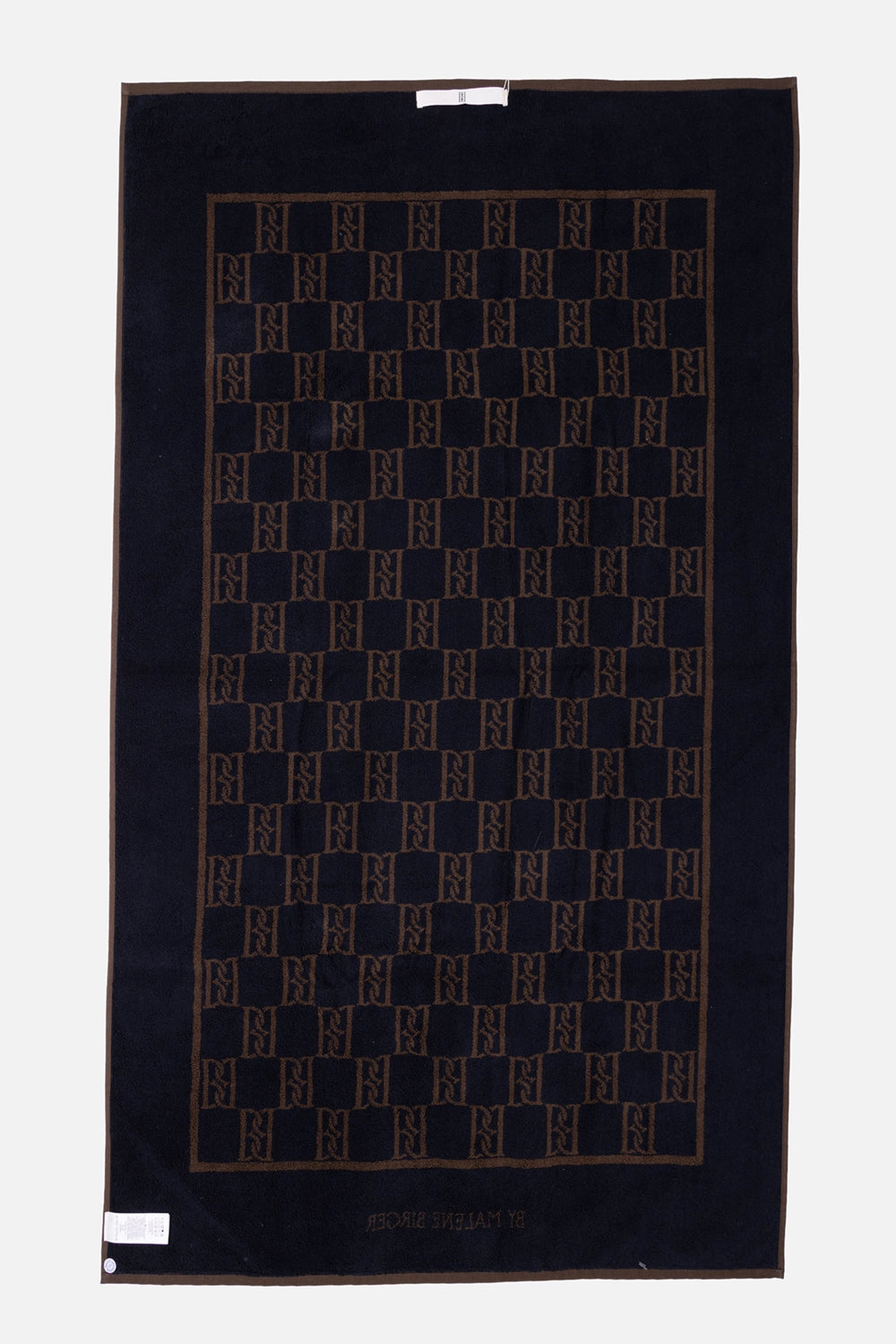 By Malene Birger towel in Dark Mahogany, back view, tonal monogram pattern with logo at hem