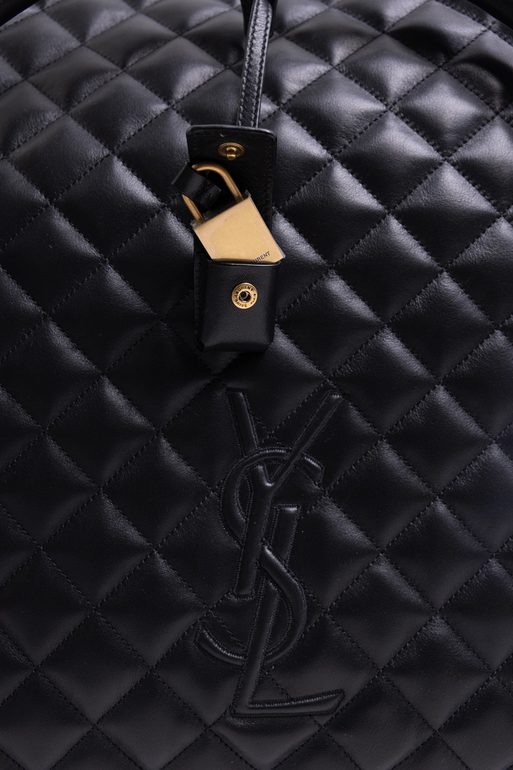 Pre-owned Saint Laurent unisex travel bag in black, padlock detail, gold padlock in leather case on quilted panel
