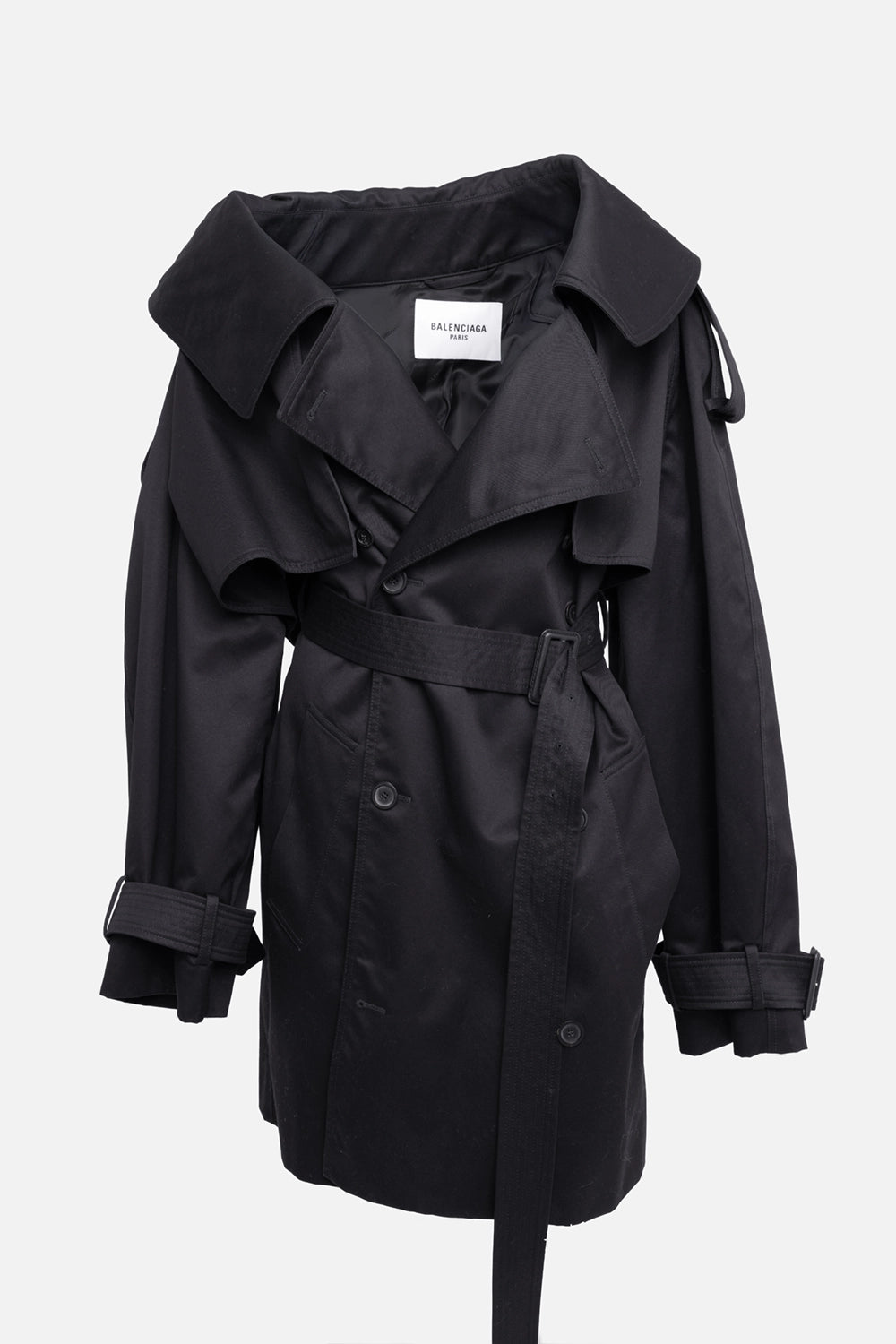 Pre-owned Balenciaga women's trench coat in black, 3/4 view, oversized collar with belted waist and cape-style yoke