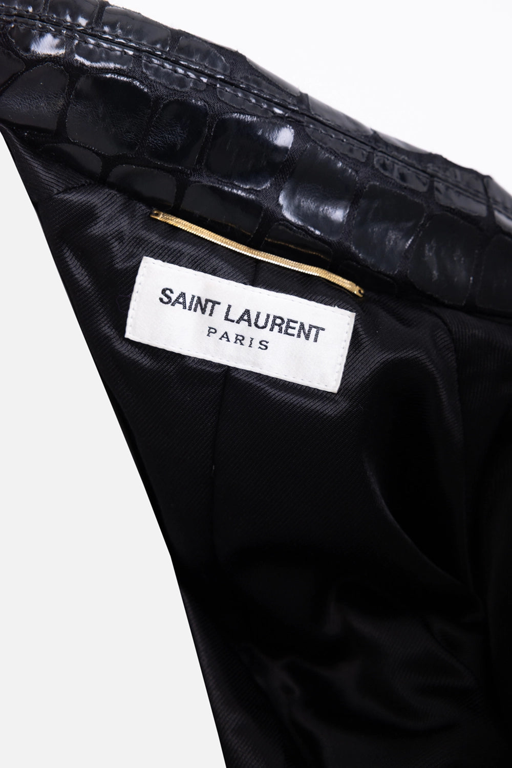 Pre-owned Saint Laurent women’s trench coat in black, interior label view, Saint Laurent Paris patch and zip pocket