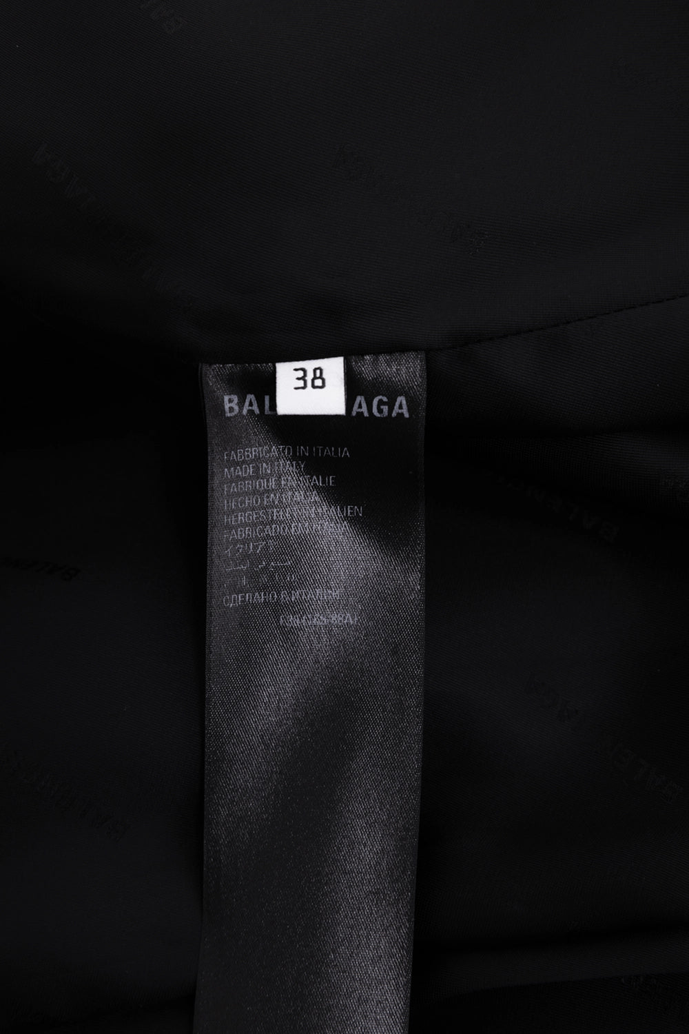 Pre-owned Balenciaga women's trench coat in black, label view, Balenciaga tag with size 38