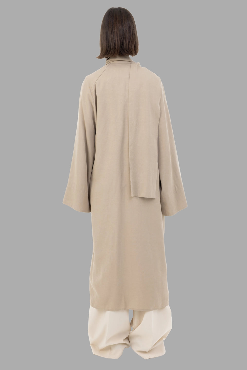 By Malene Birger women trench coat in Tehina, back view, scarf panel draped at neck.