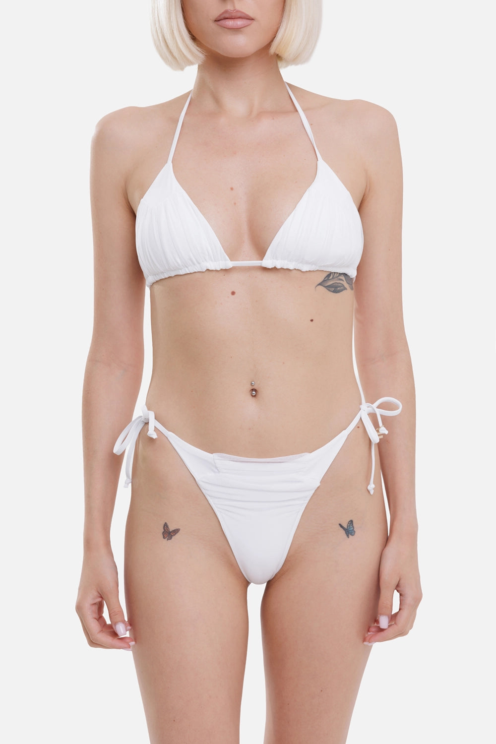 Fisico women triangle bikini in white, on-model half length, halter straps and bow-tie briefs