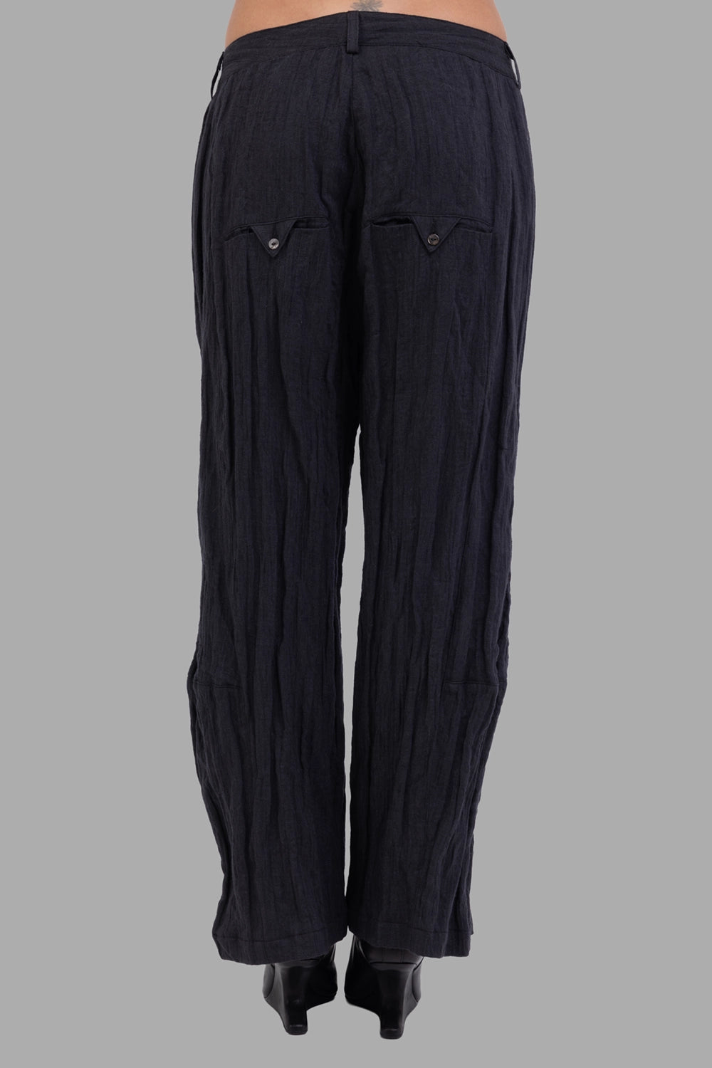 Marc Point women trousers in black, back view, twin flap pockets with buttons and vertical crinkles