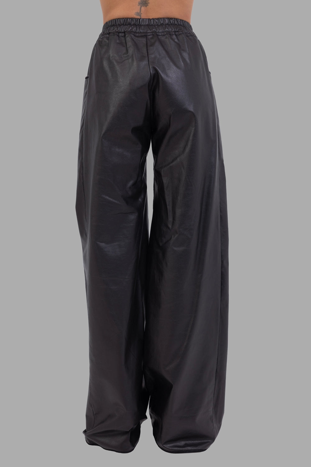 Isaac Sellam Experience women's leather trousers in black, back view, wide leg and smooth seat without pockets.