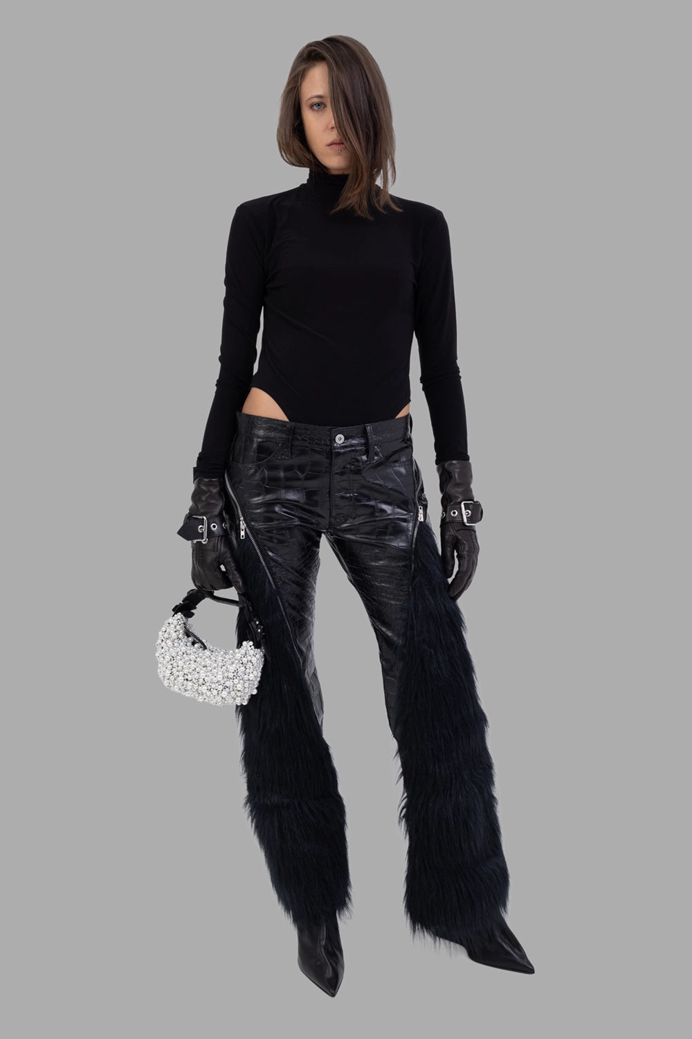 Junya Watanabe women trousers in black, on-model full length, croc-embossed faux leather with faux-fur panel inserts.