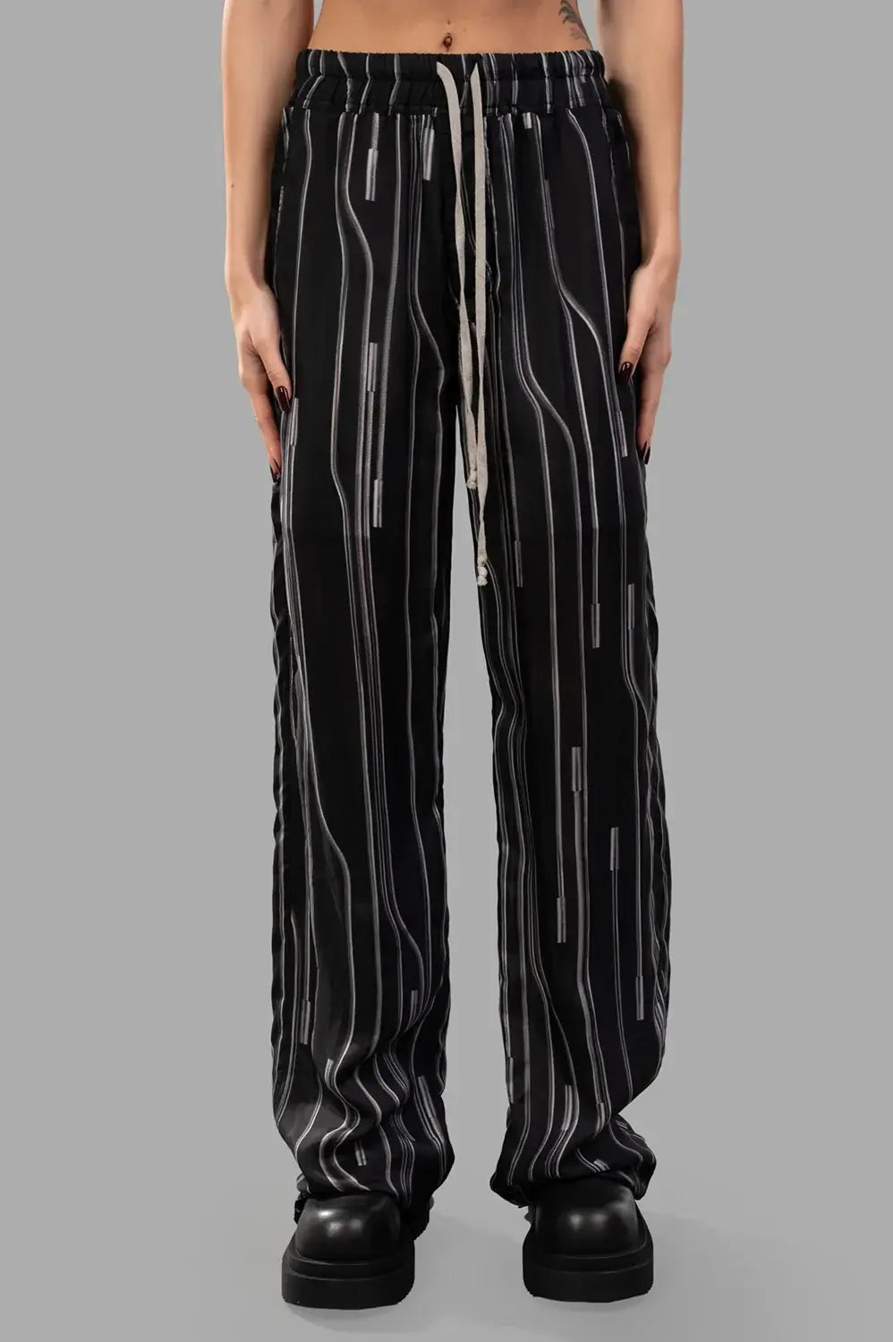 Rick Owens trousers in Black/Pearl, fabric close-up from back highlighting black/pearl vertical stripes.