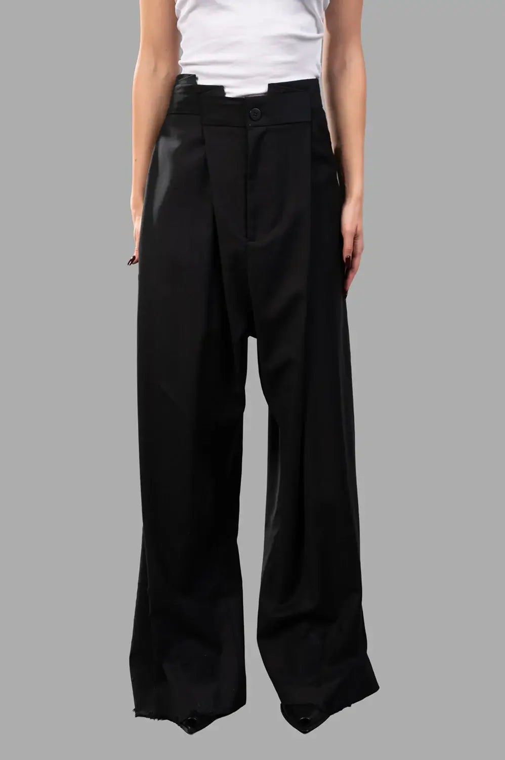 Natasha Zinko trousers in black wool, front view, folded waistband and button closure
