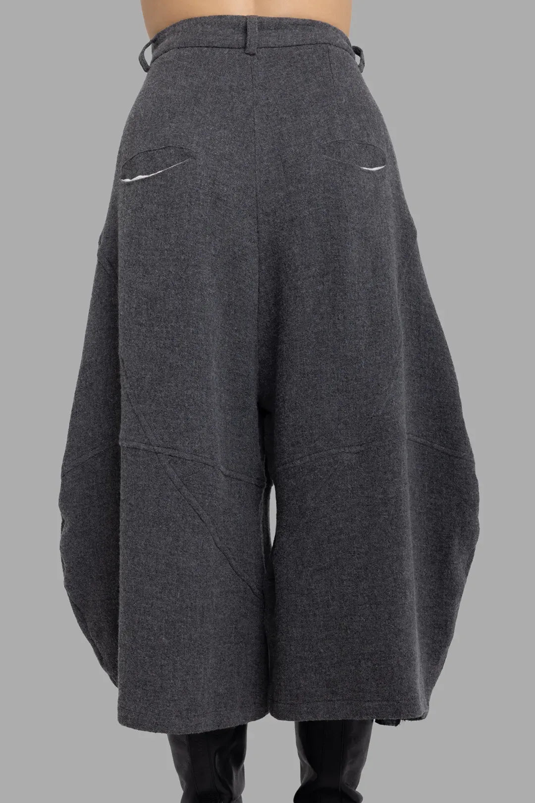 Marc Point unisex charcoal grey trousers, back view highlighting curved balloon leg silhouette and welt pockets.