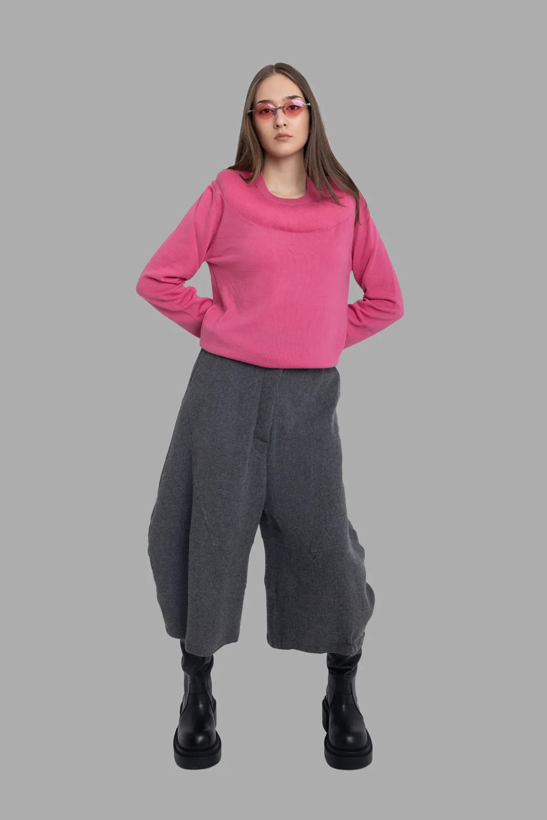 Marc Point unisex charcoal grey wide trousers, on-model full-length front view with sculptural curved legs.