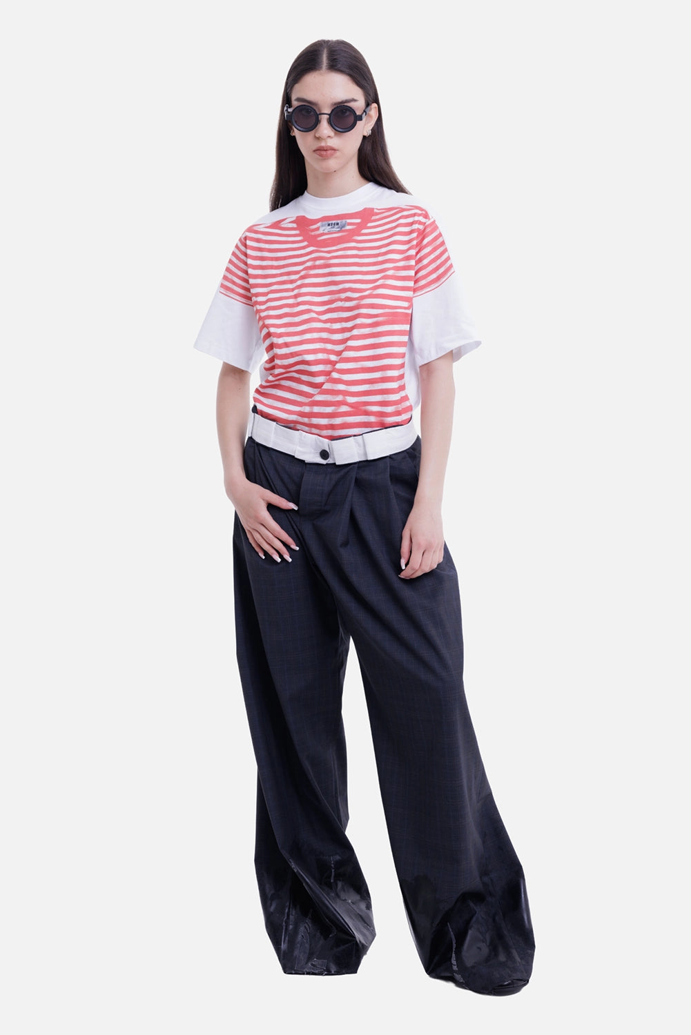 Natasha Zinko women's dark grey trousers, model view with white rolled waist and pooled wide legs