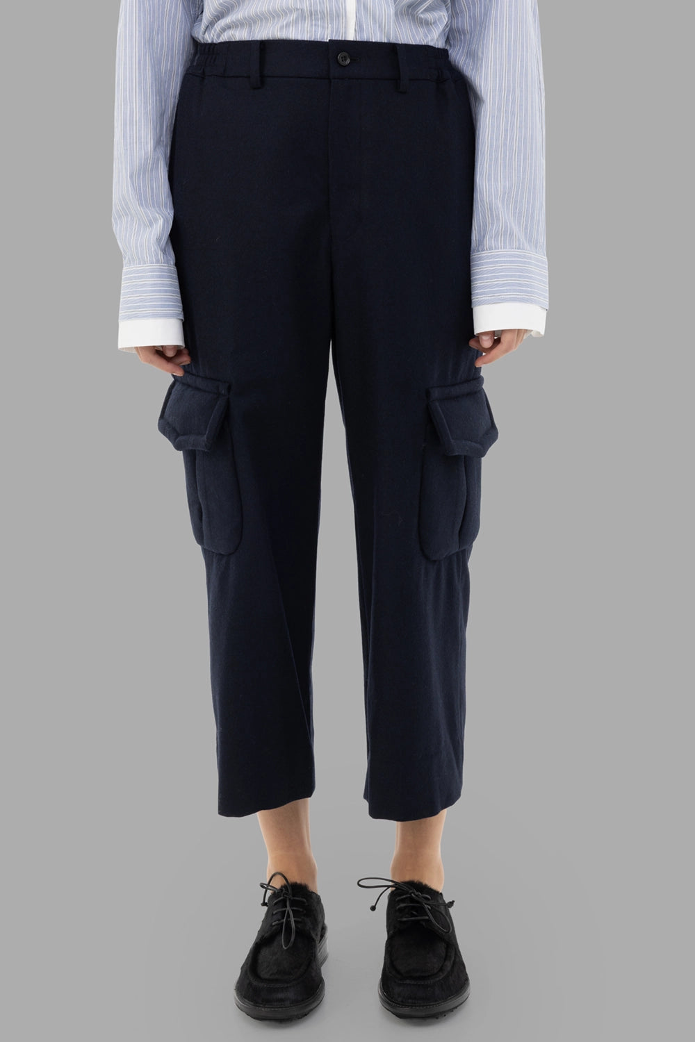 Comme des Garçons women cargo trousers in navy, front view, belt loops and twin flap cargo pockets.