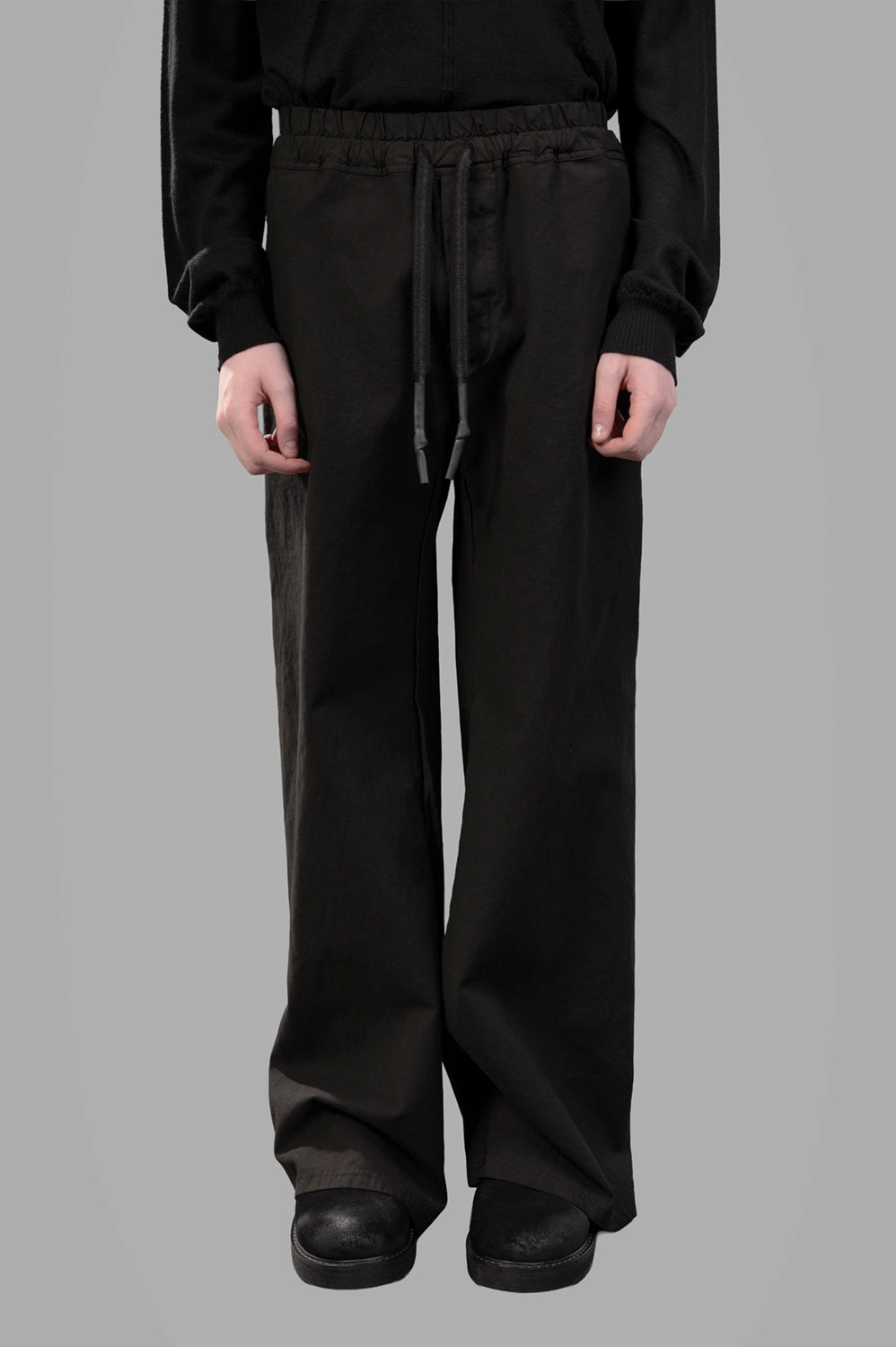69 by Isaac Sellam trousers in noir, front view, elastic waistband with long drawstring