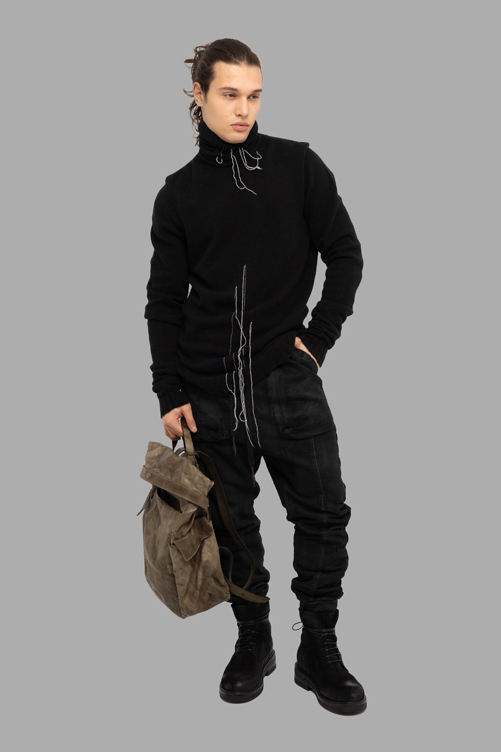 MD75 men’s turtleneck sweater in black/white, on-model full length, contrast white yarn tails
