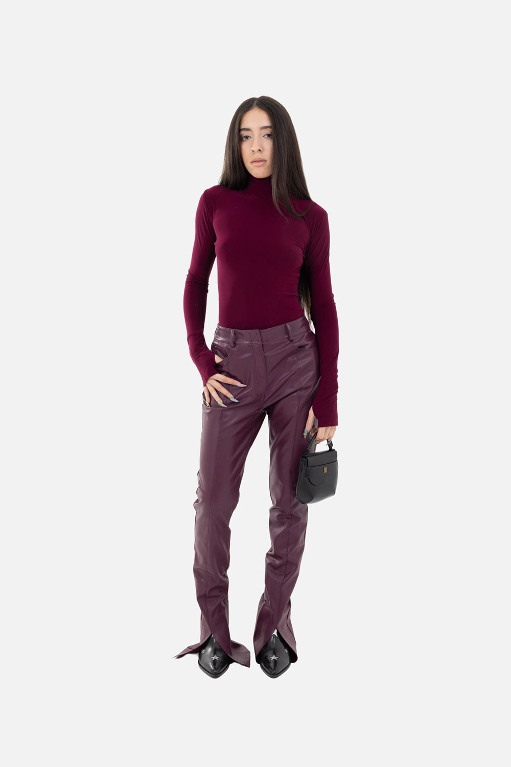 Norma Kamali women's turtleneck top in plum, on-model full-length, sleek fitted layer with elongated sleeves