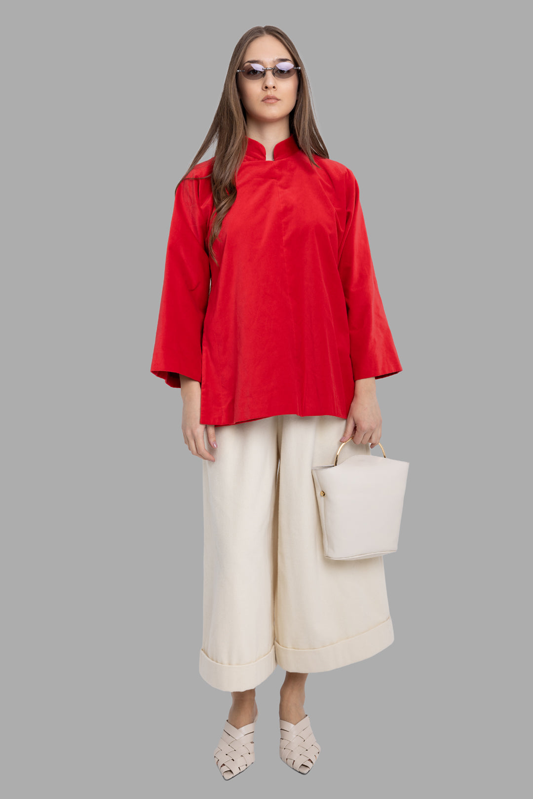 Comme des Garçons women's red velvet jacket, on-model full length, mandarin collar and wide sleeves.