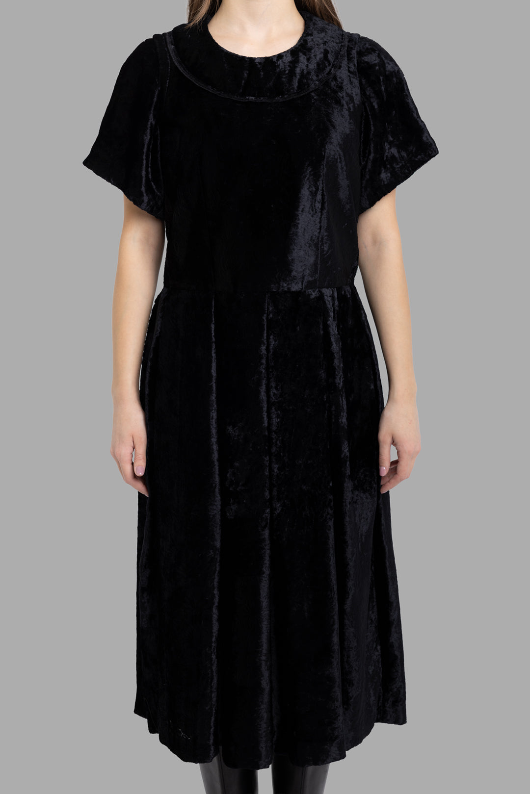 Comme des Garçons women's black velvet midi dress, front view with rounded collar and gently gathered midi skirt.