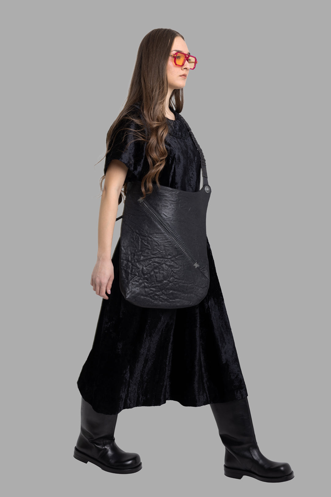 Comme des Garçons women's black velvet midi dress, on-model full length side view, soft sheen and flared skirt.