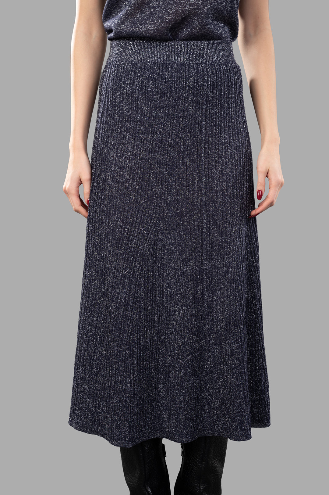Joseph Metallic Fibre Knit Skirt shown on model, highlighting ribbed texture and A-line silhouette in Aurora purple.