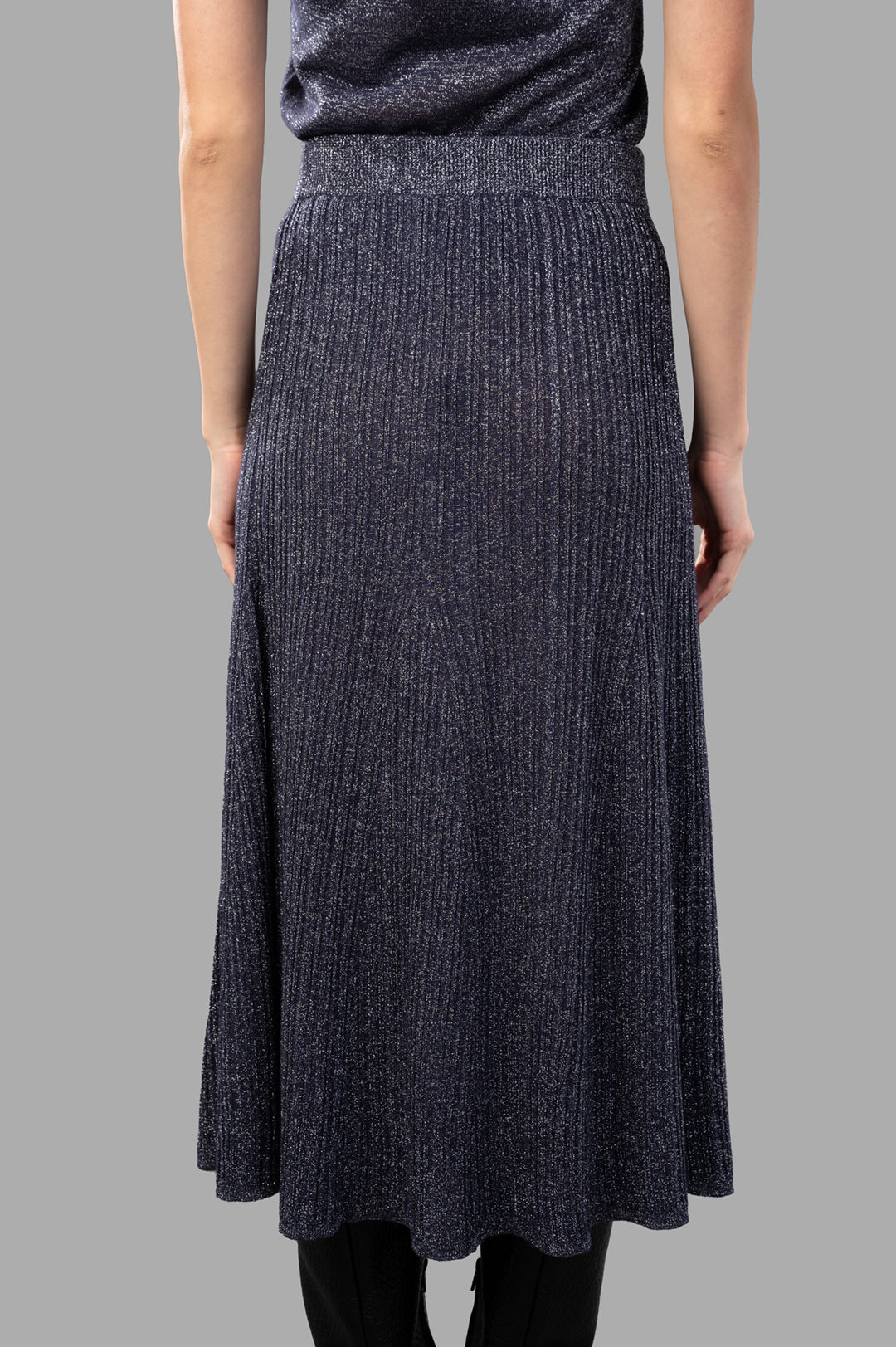 Joseph Metallic Fibre Knit Skirt, A-line style, ribbed texture, Aurora purple, seen from the back on a model.