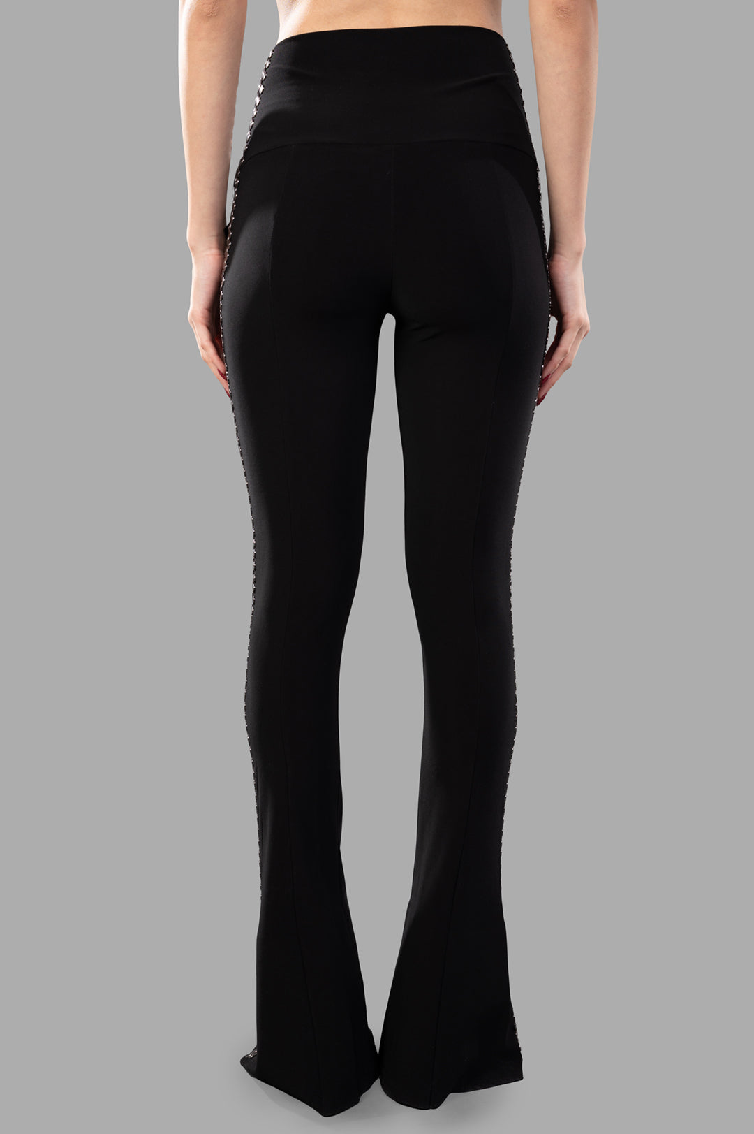 Norma Kamali Stud Spat Legging featuring a high waist, back view with silver studs along the sides and flared hem design.