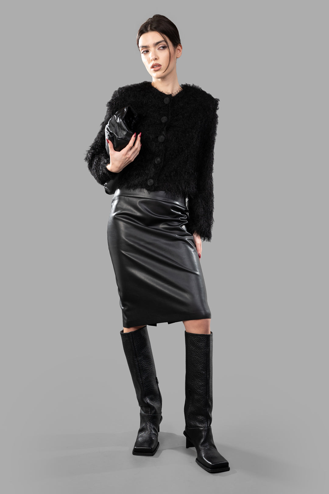 By Malene Birger Stephania Cardigan in black, front view on model, featuring a fluffy texture and button closure.