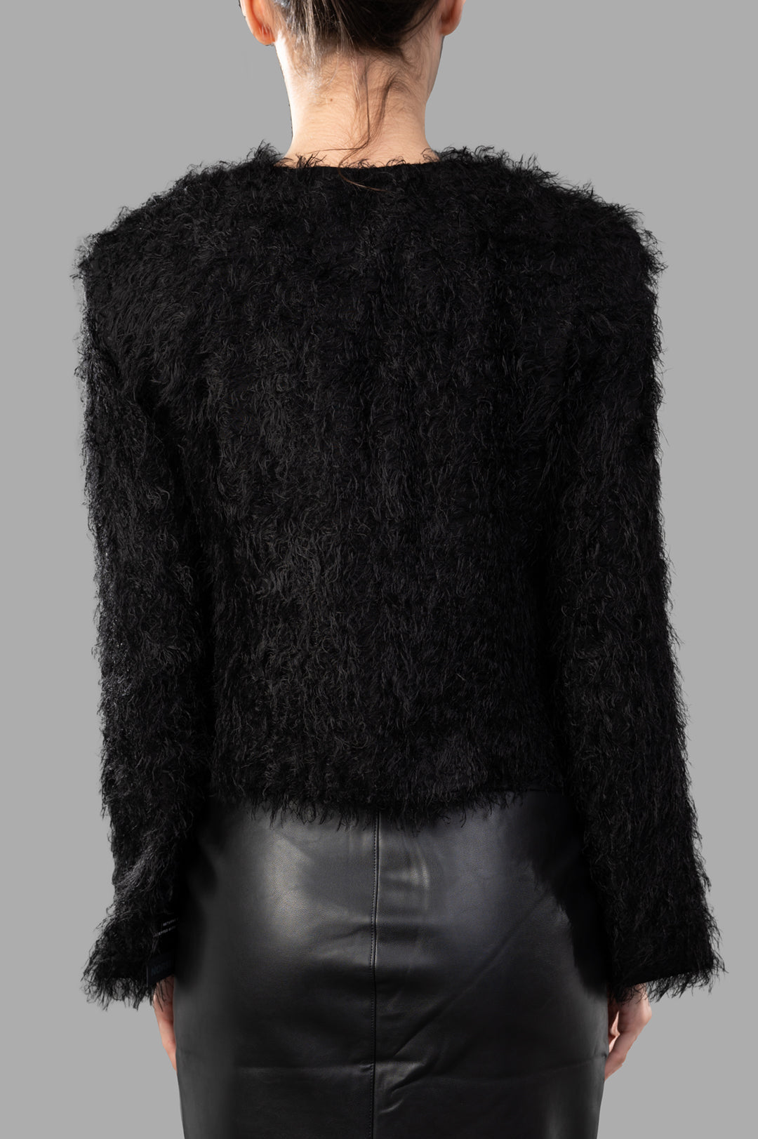 By Malene Birger. Back view of Stephania Cardigan in black, showcasing soft, fluffy texture and classic silhouette.