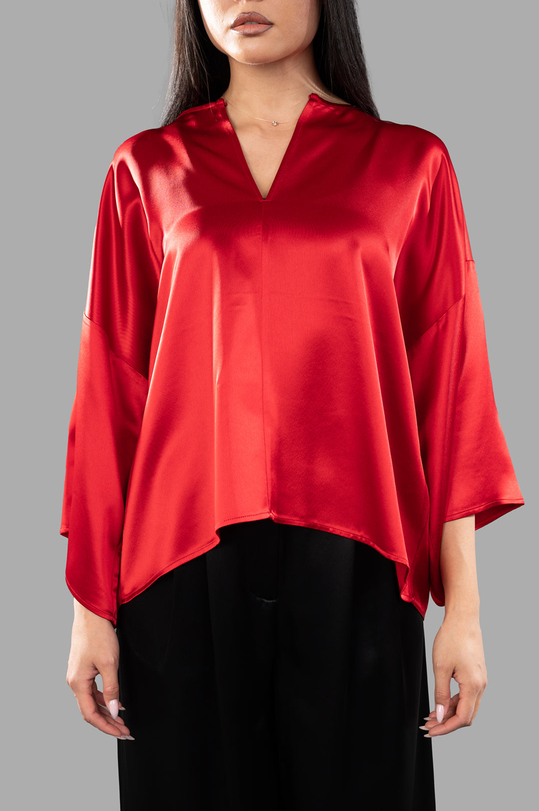 By Malene Birger Cicie Blouse in red, featuring a deep neckline, dropped shoulders, and wide-cropped sleeves for elegant style.