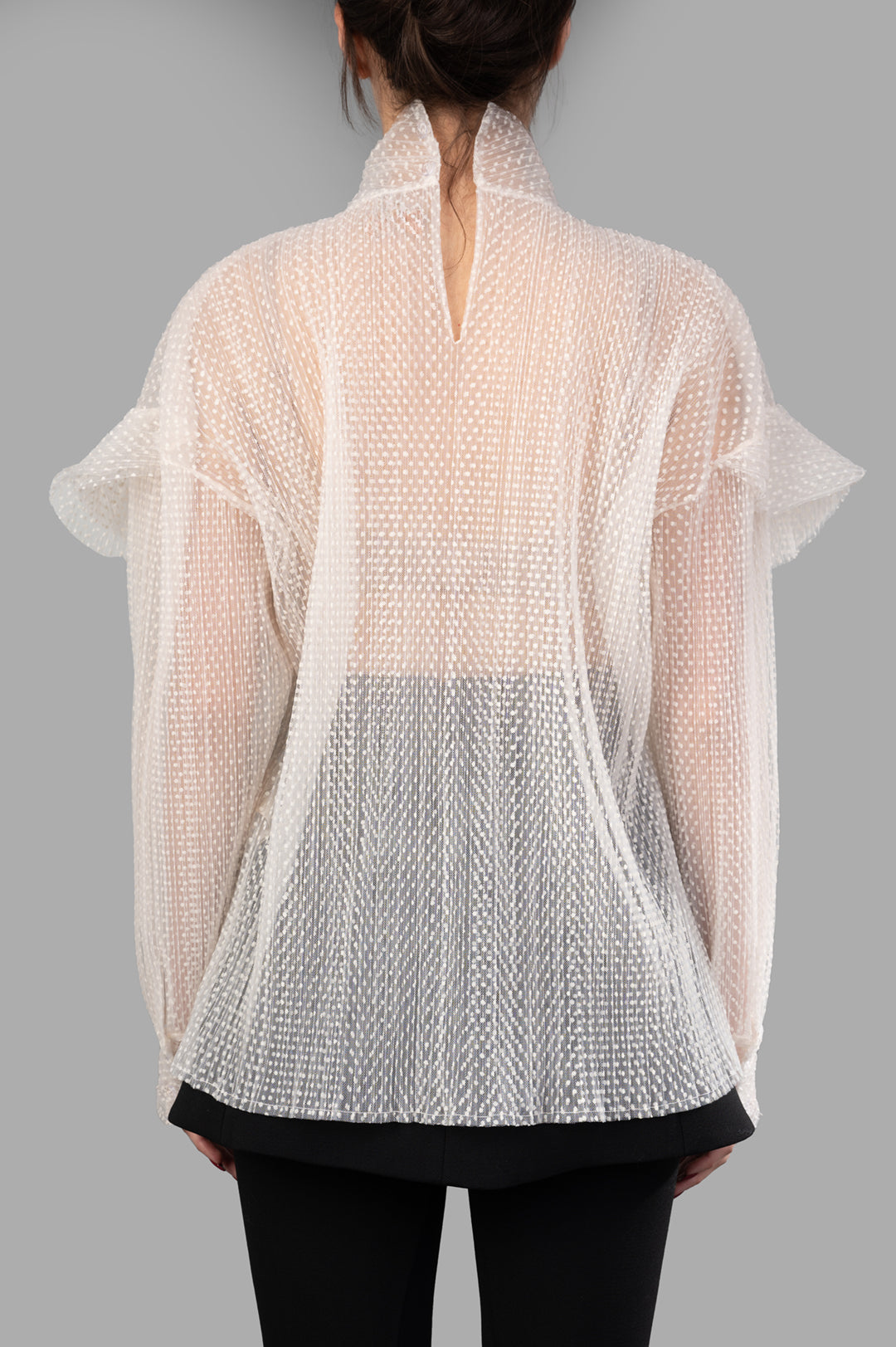 A.W.A.K.E. MODE Double Layered Tulle Top featuring textured details, frill accents, and a high neckline, shown from the back.