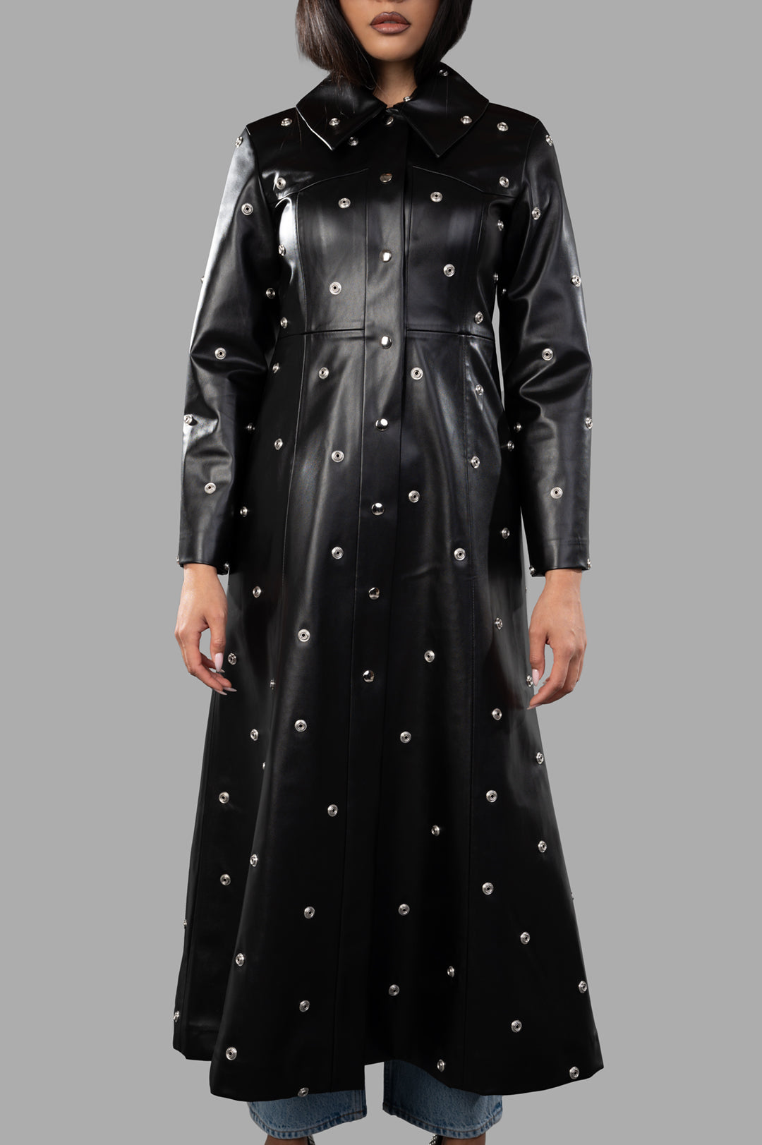 A.W.A.K.E. MODE Faux Leather Studded Coat displayed on model, featuring a fitted bodice and statement studs.