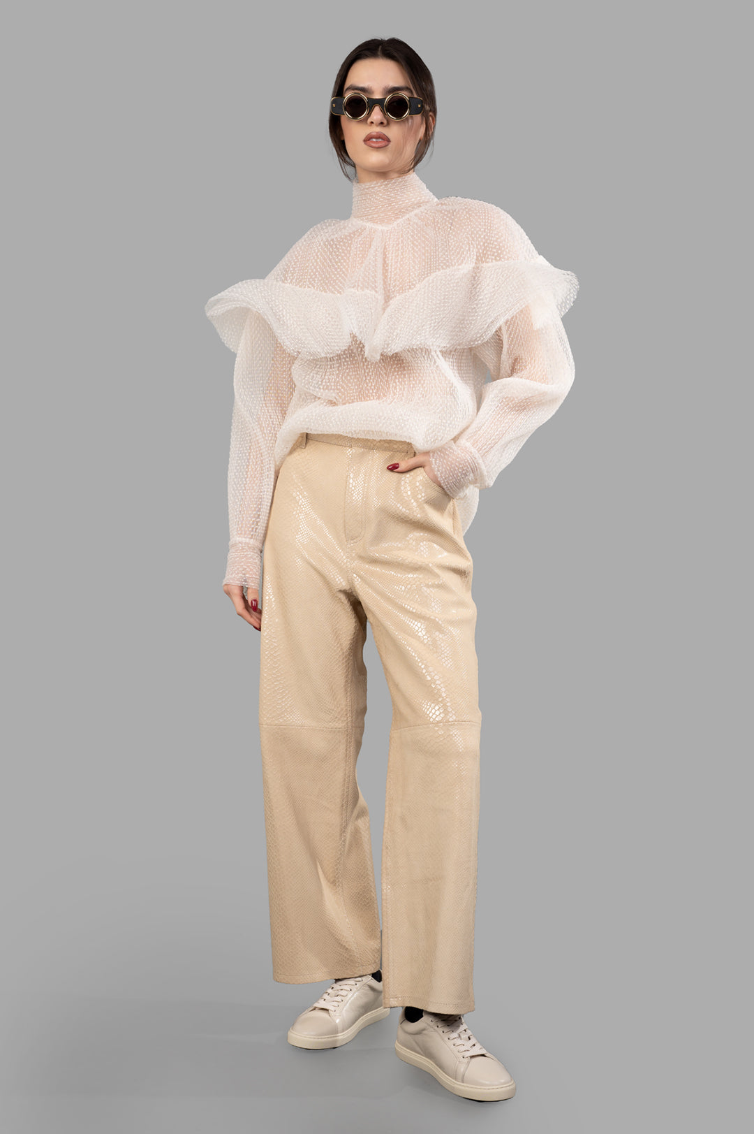 By Malene Birger Cailys Leather Trousers, front view on-model with sheer top, styled with sneakers.