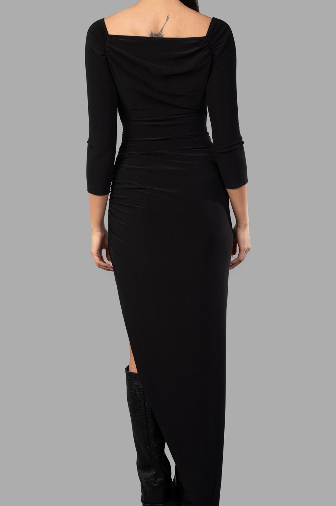 Norma Kamali Side-drape Dress shown from the back, featuring shirred sides and a sophisticated black fabric.