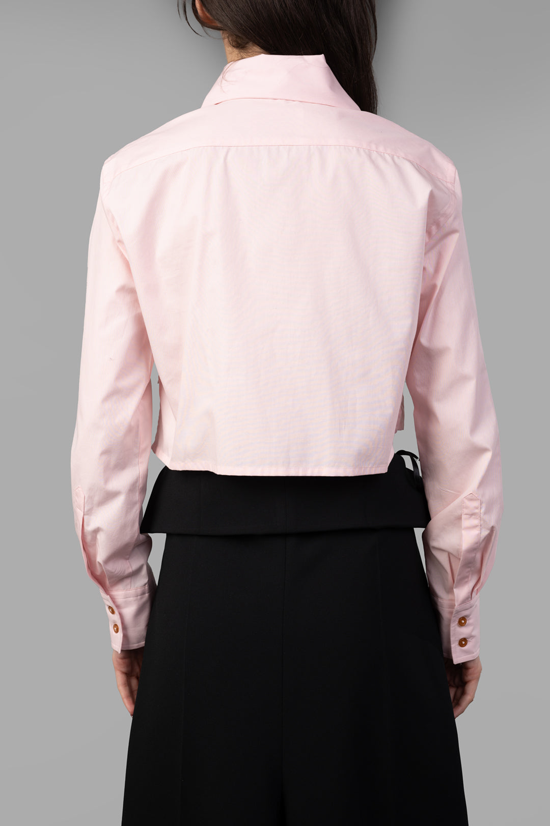Vivienne Westwood Cut-off Heart Shirt, pink cotton with cut-out neckline, raised collar, styled on model from the back.