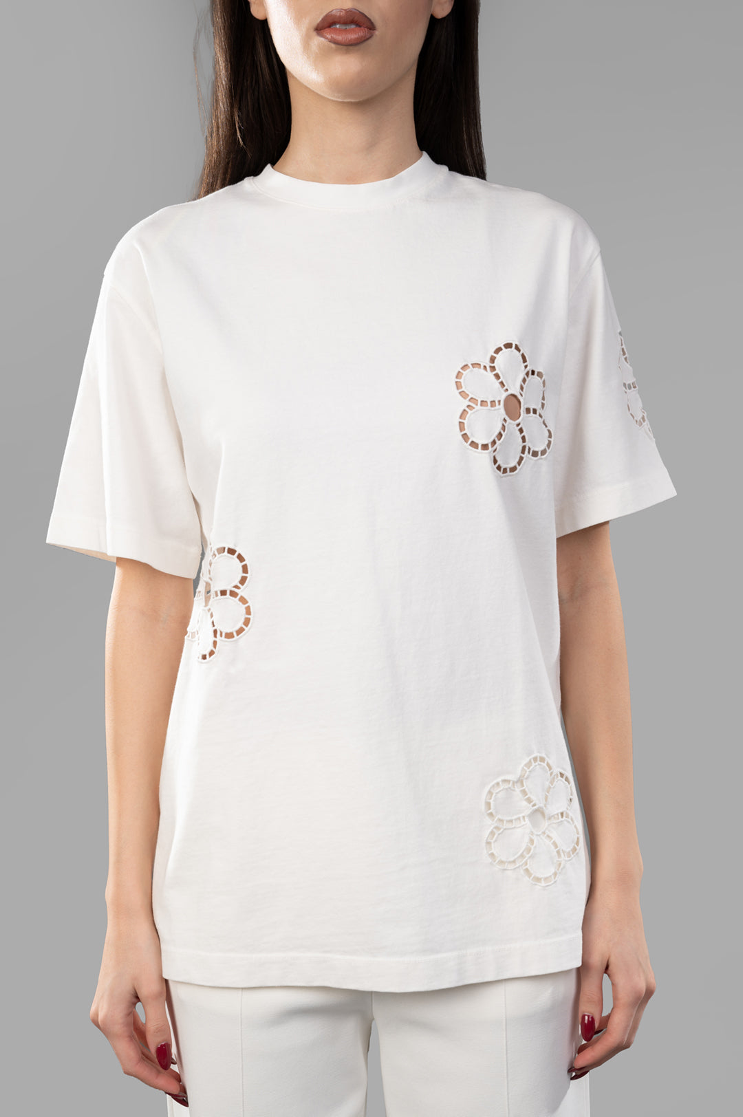 MSGM Floral-Appliqué T-Shirt featuring rib-knit crewneck and broderie anglaise floral details on front and sleeve.
