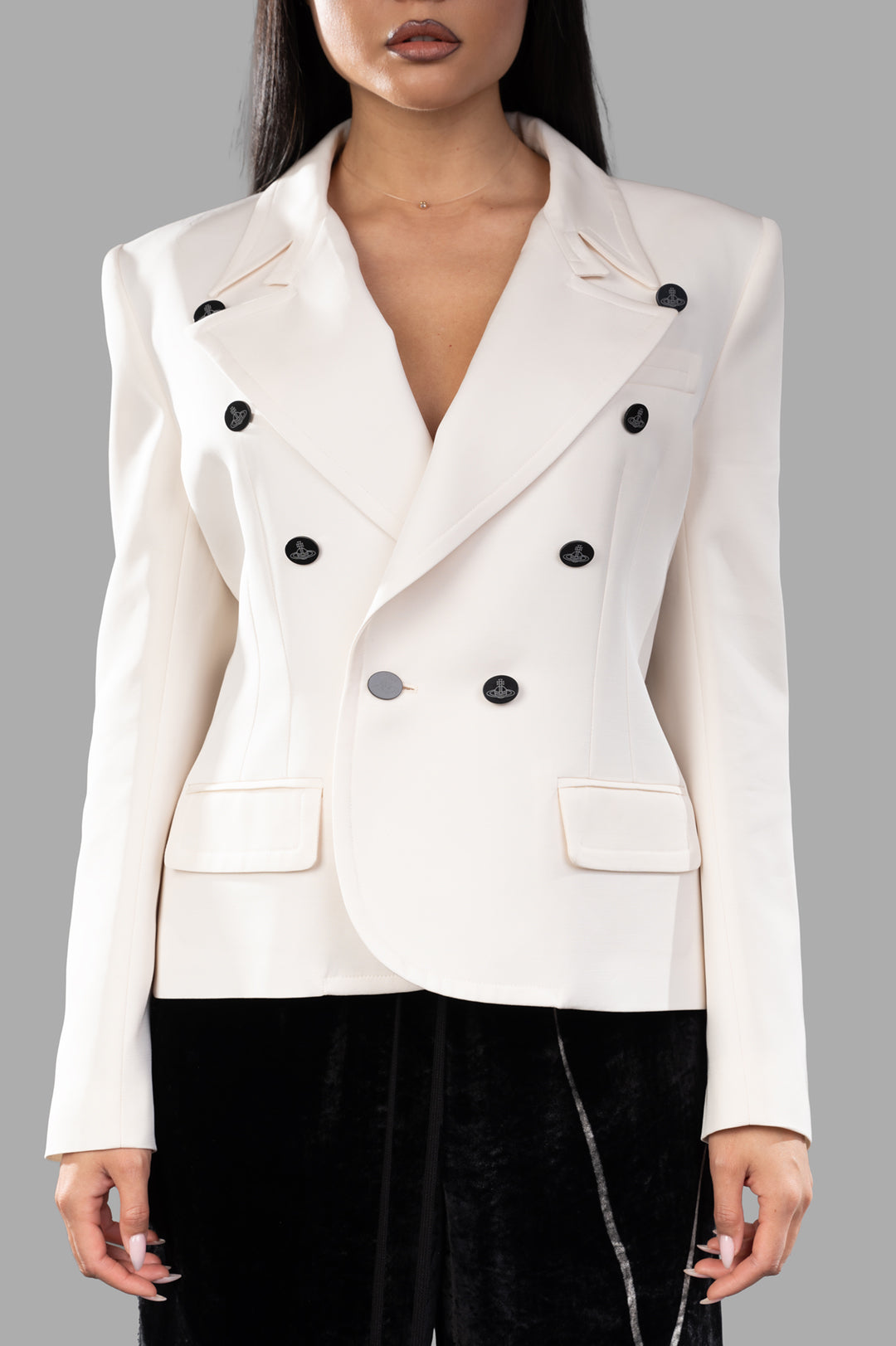 Vivienne Westwood Stewart Jacket in off-white, featuring unique oval orb buttons and notch lapel, displayed on model.