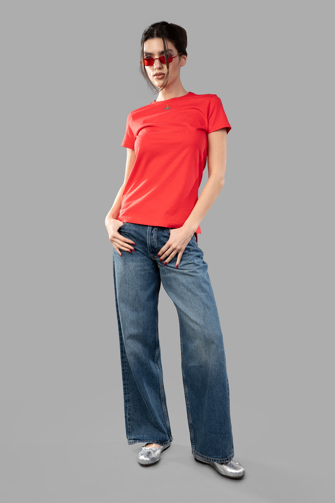 Vivienne Westwood Orb Logo T-shirt in coral, worn by model; features crewneck, short sleeves, embroidered logo front.