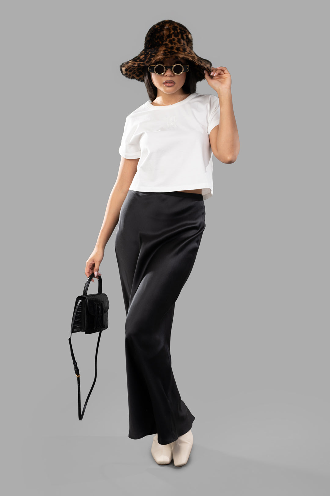 By Malene Birger Hedalia Organic Cotton T-shirt in white, shown on model with folded sleeves and slightly cropped fit.