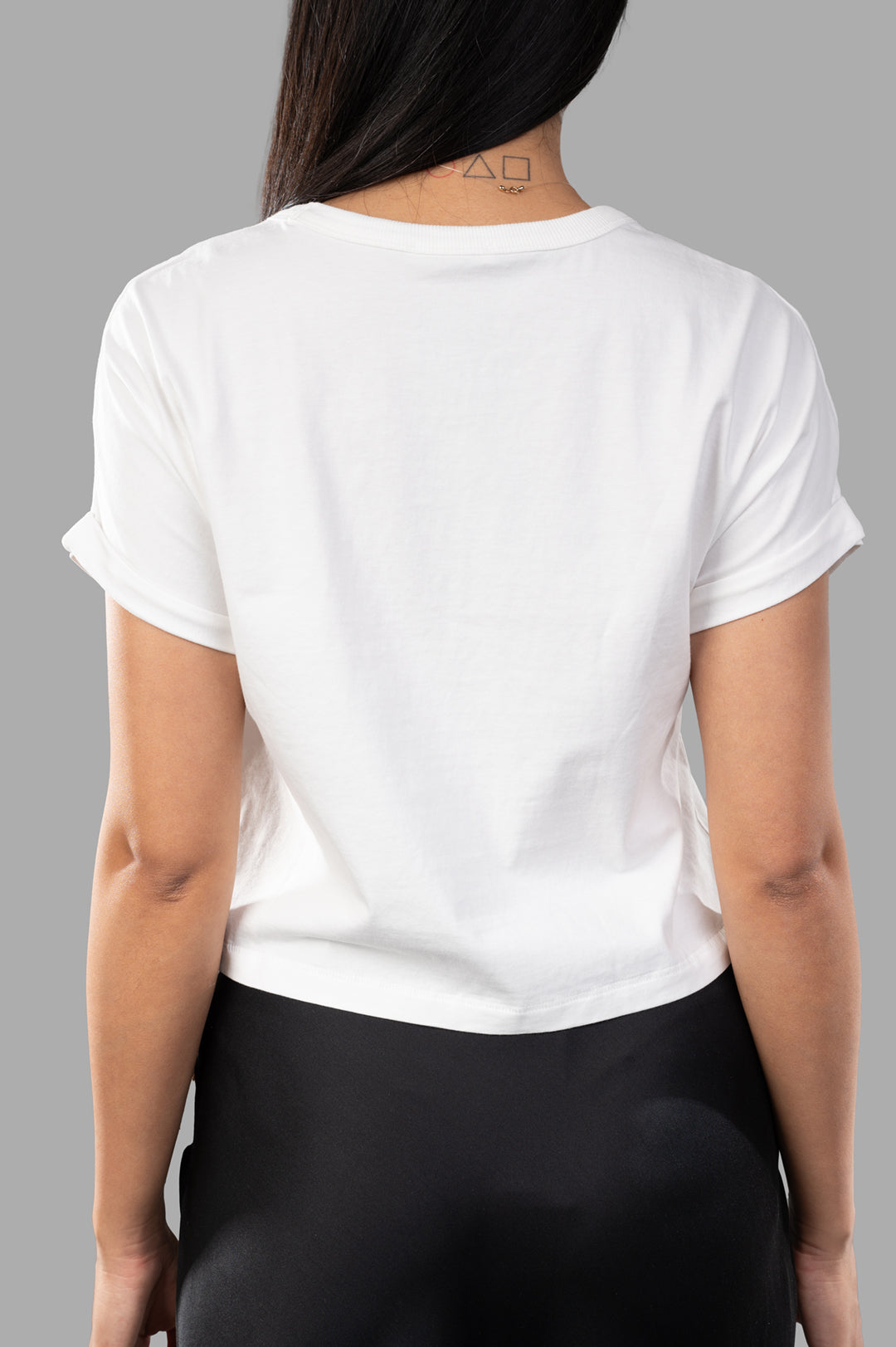 By Malene Birger. Hedalia Organic Cotton T-shirt in white, showcasing the back view with cropped silhouette and folded.