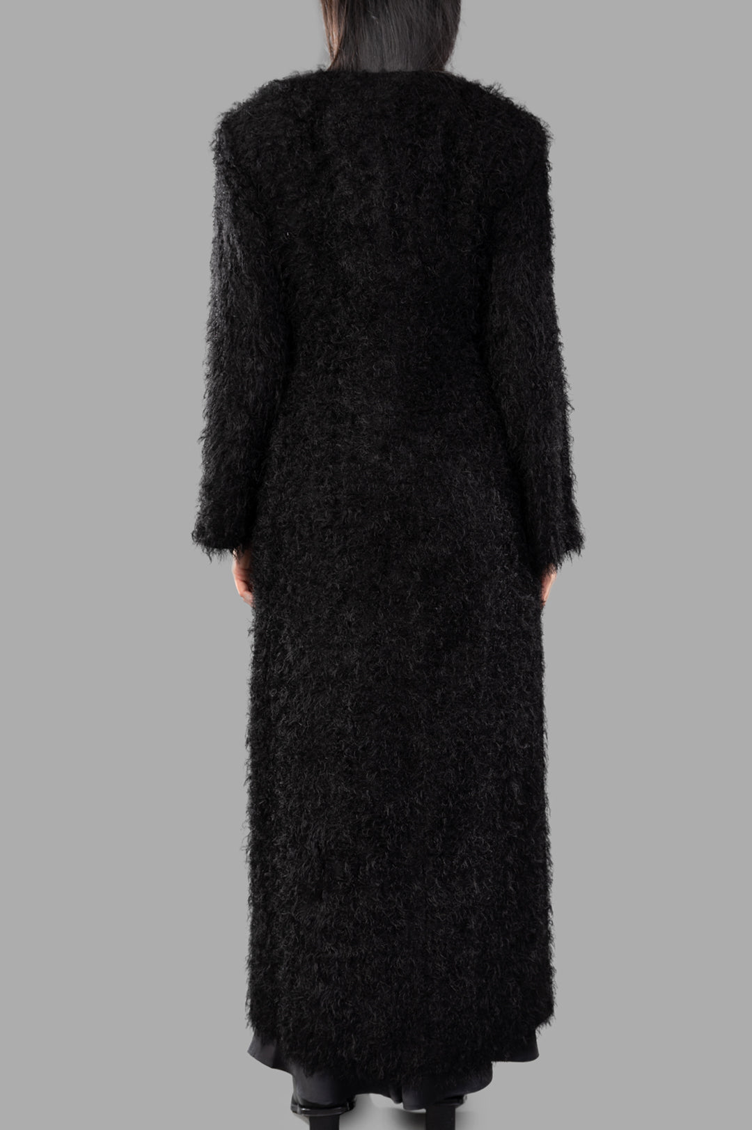 By Malene Birger Susenne Textured Cardigan shown from the back, featuring a fuzzy black design and long, elegant silhouette.